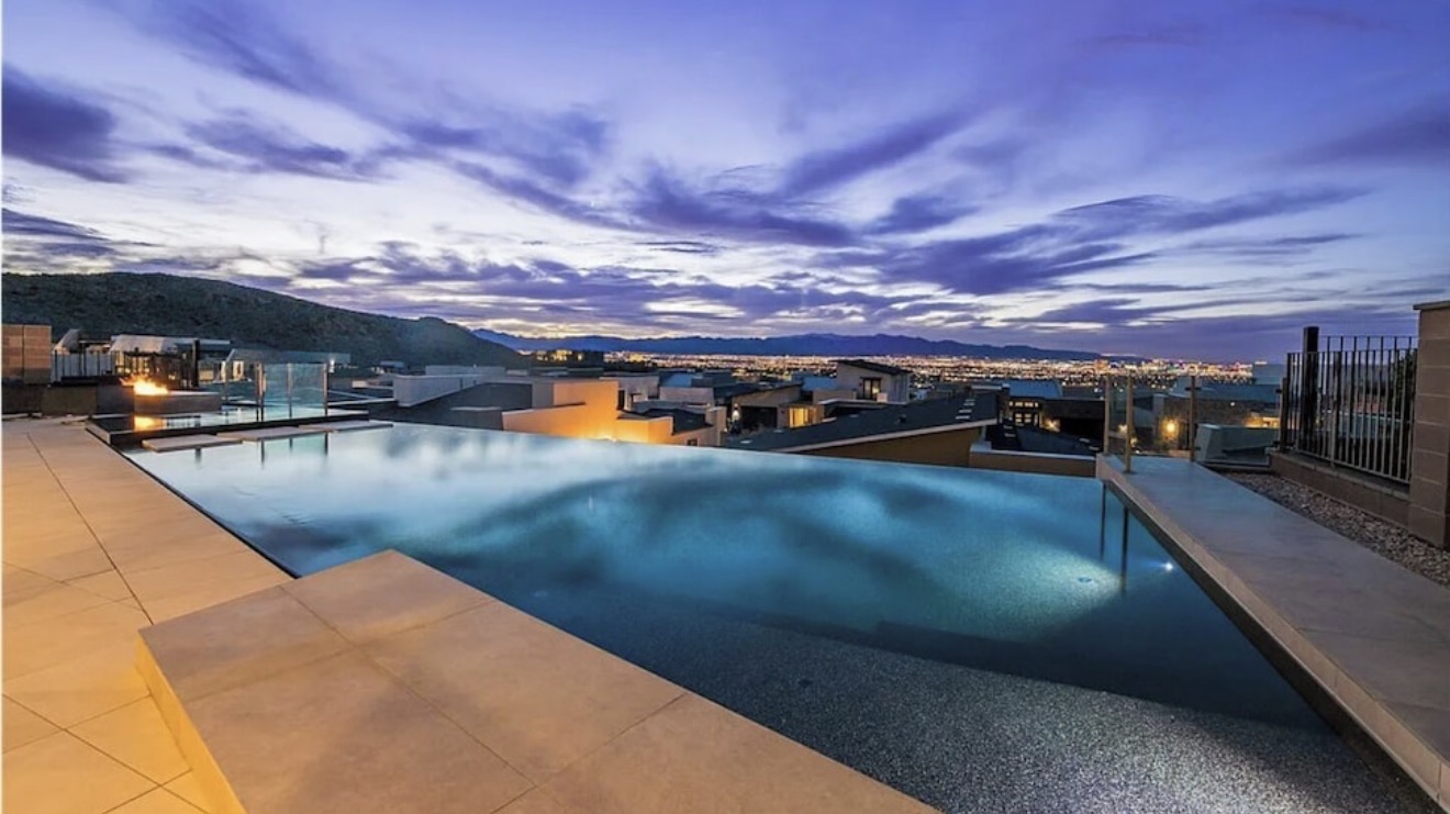 Illuminated infinity pool overlooking the Las Vegas valley at dusk